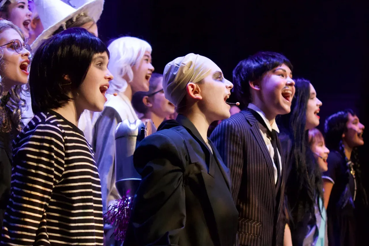 VPS Academy students performing a musical theatre ensemble on stage at Vancouver Performing Stars