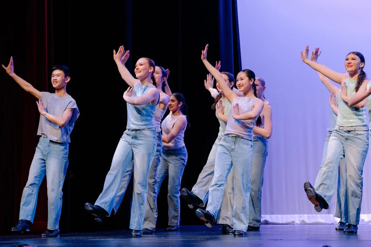 VPS Academy students performing a tap dance ensemble on stage at Vancouver Performing Stars