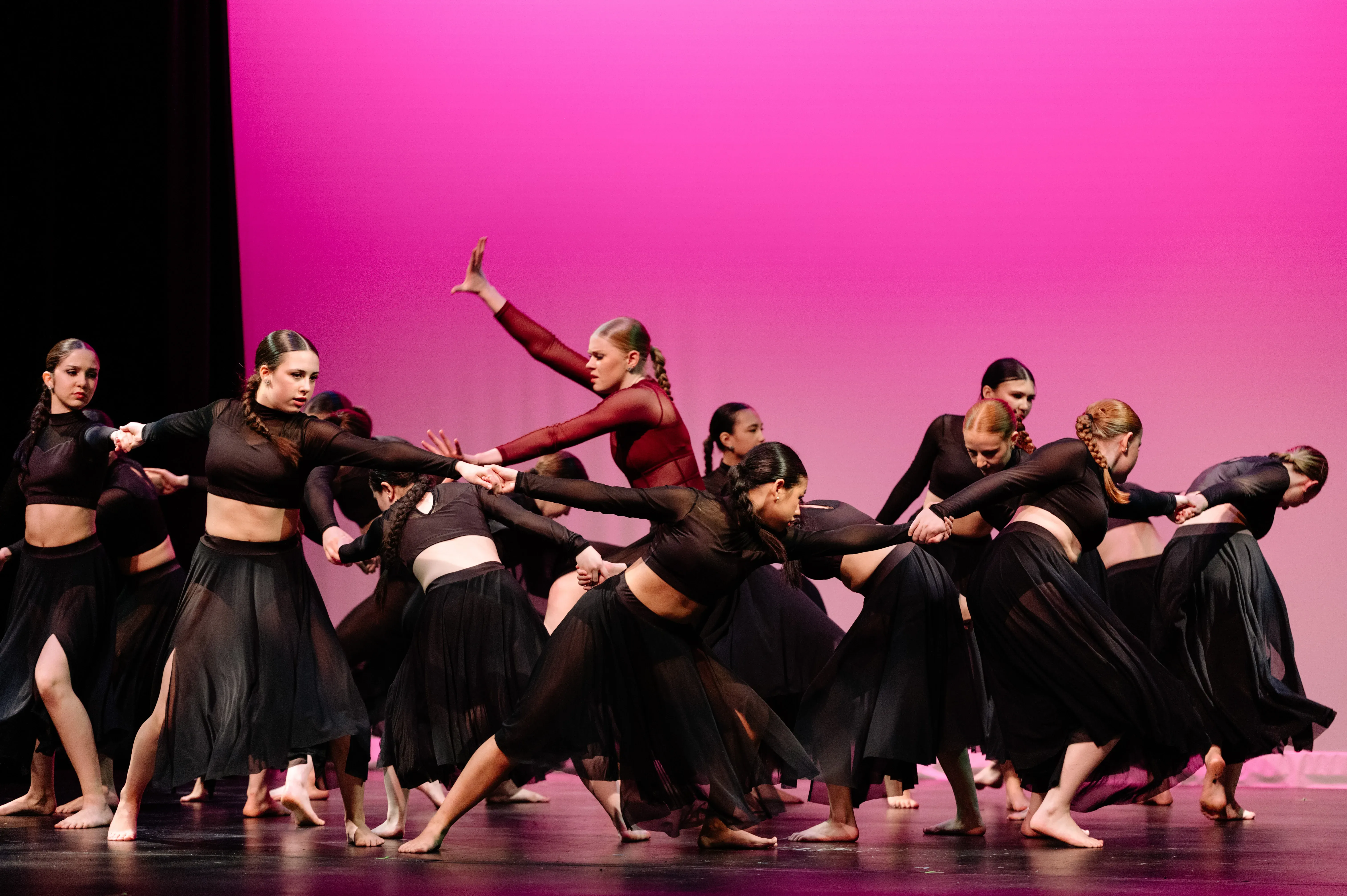 VPS competitive dance team performing contemporary ensemble on stage