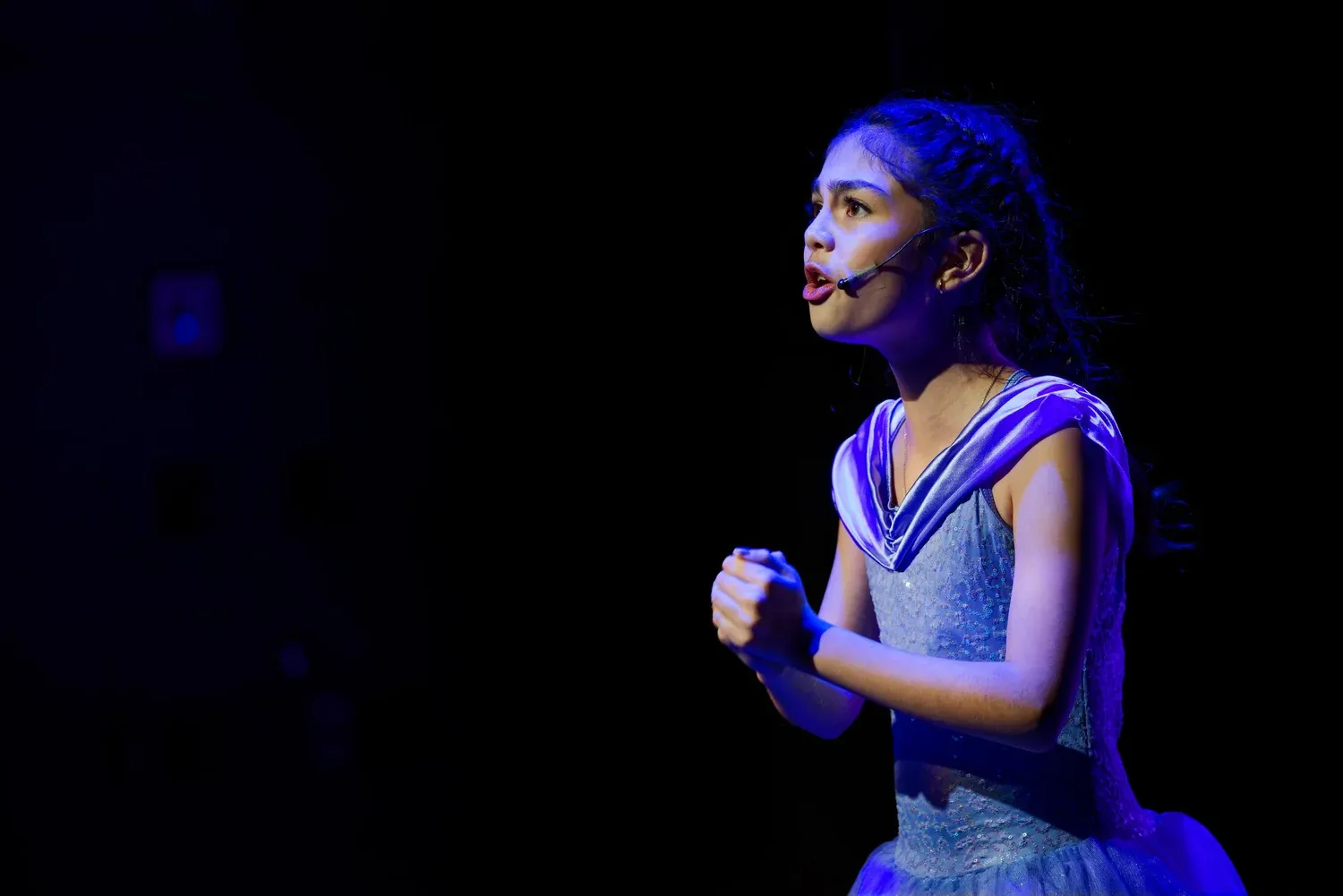 VPS students performing a musical theatre number in costume on stage