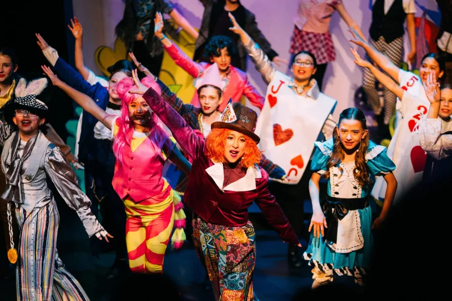 VPS Embers Musical Company — kids in Alice in Wonderland costumes on stage