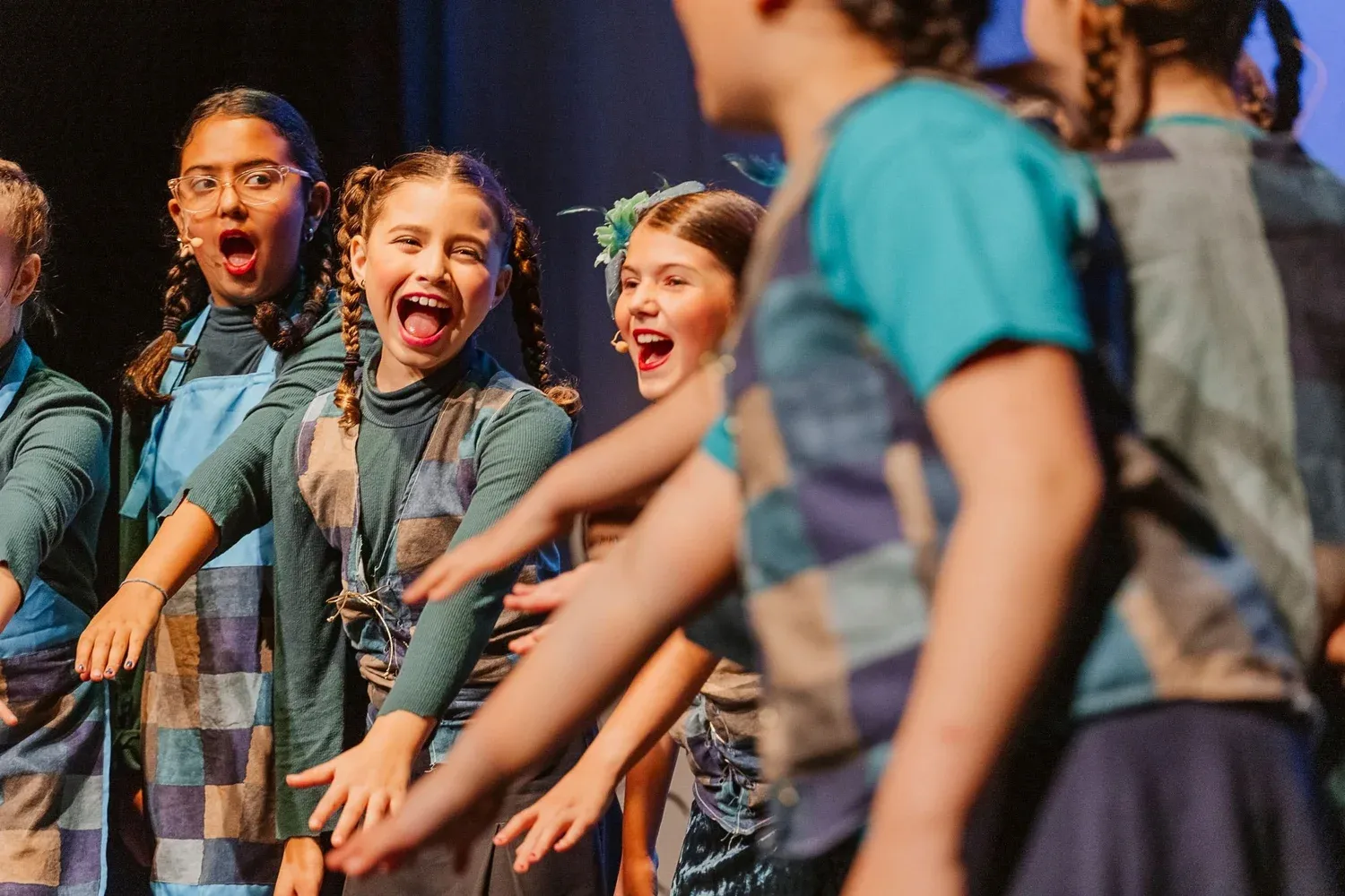 VPS students rehearsing on stage