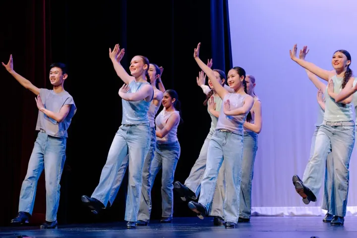VPS dance team performing a tap number in denim on stage